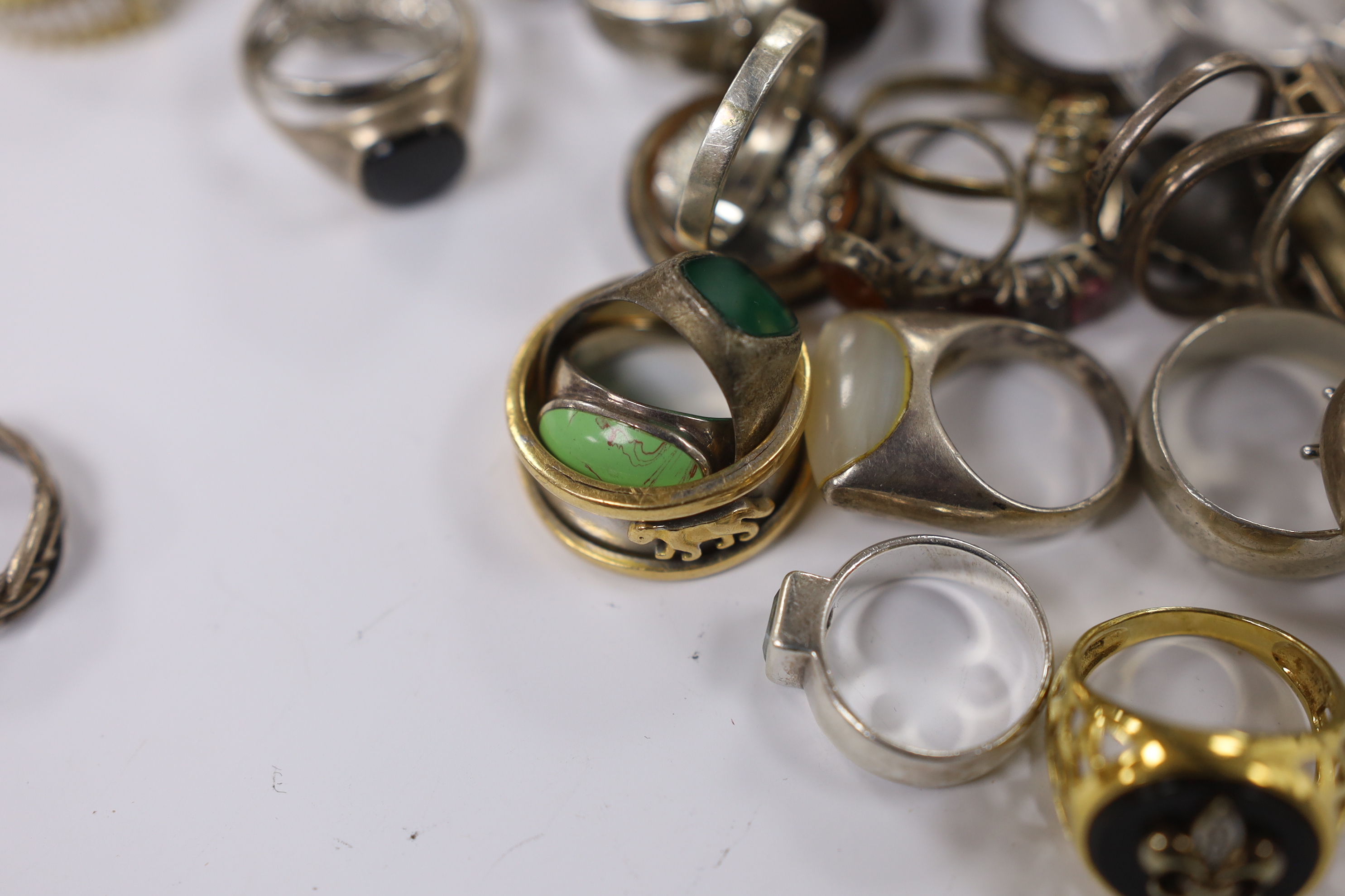 A quantity of assorted mainly white metal and 925 dress rings.